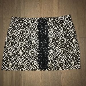 TIBI MINI SKIRT WITH LACE EMBROIDERY DETAIL